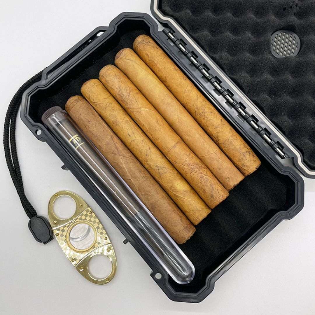 Cigar case with cigars and a cutter on a white background