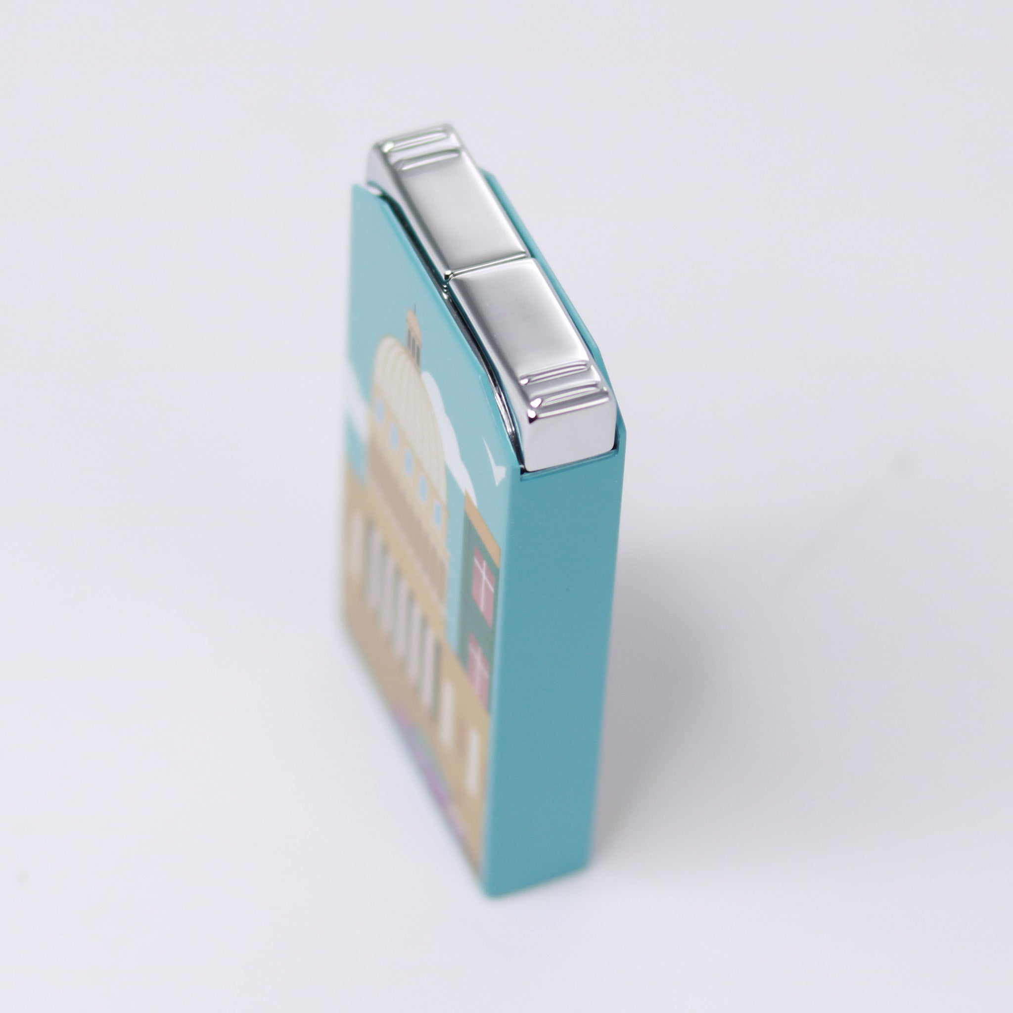 Hemingway cigar lighter, top-side view with white background