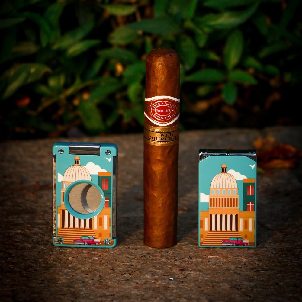 Cigar with two decorative metal cases featuring architectural designs on a dark surface.