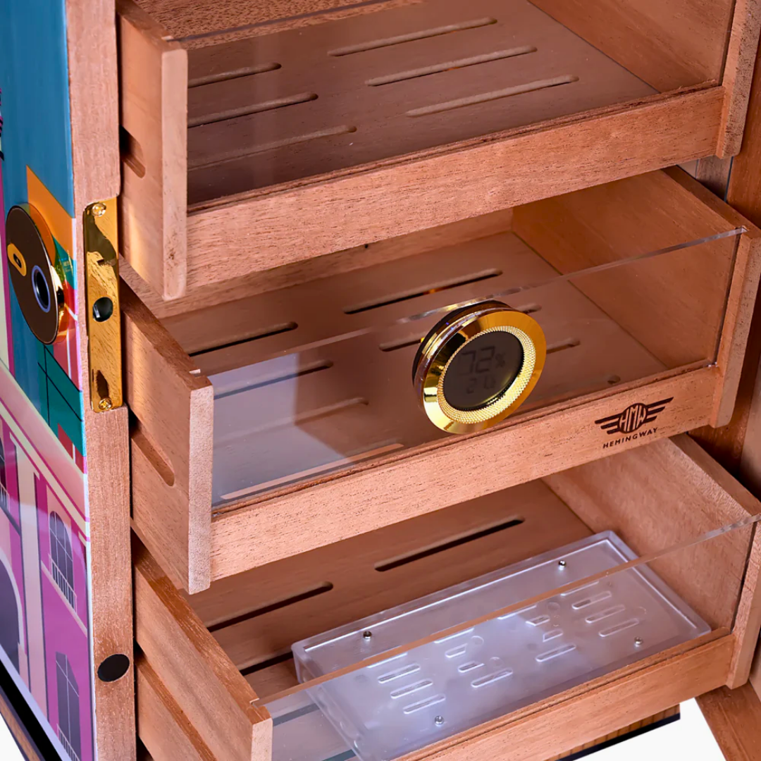 Close-up of Spanish cedar humidor shelves with digital hygrometer and humidifier tray
