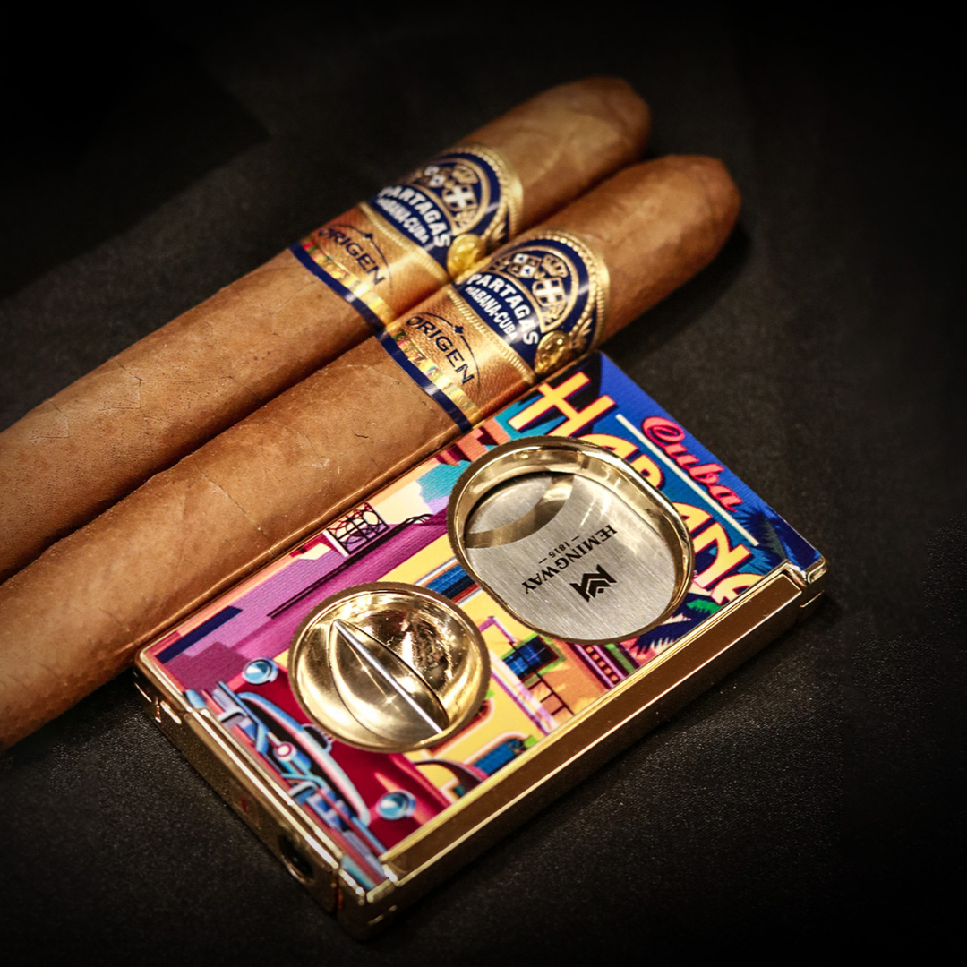 Two cigars with Hemingway Cigar Cutter Cuba Havana Design on a dark background