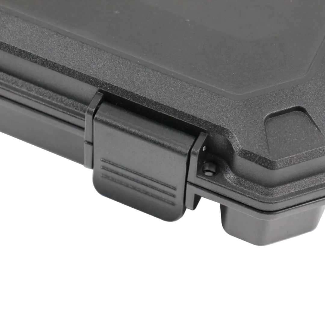 Close-up of a black plastic case with a latch on a white background