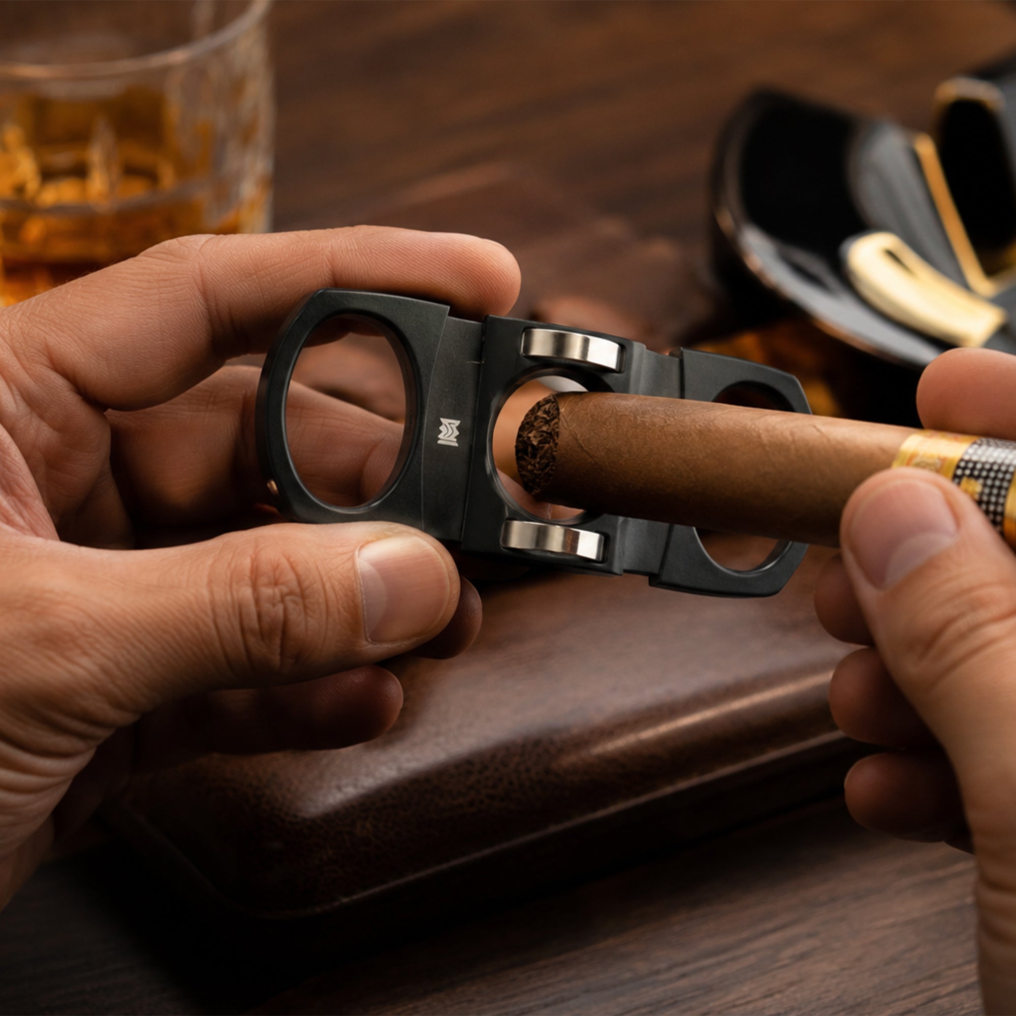 Precision Cigar Cutter Black and Silver in use